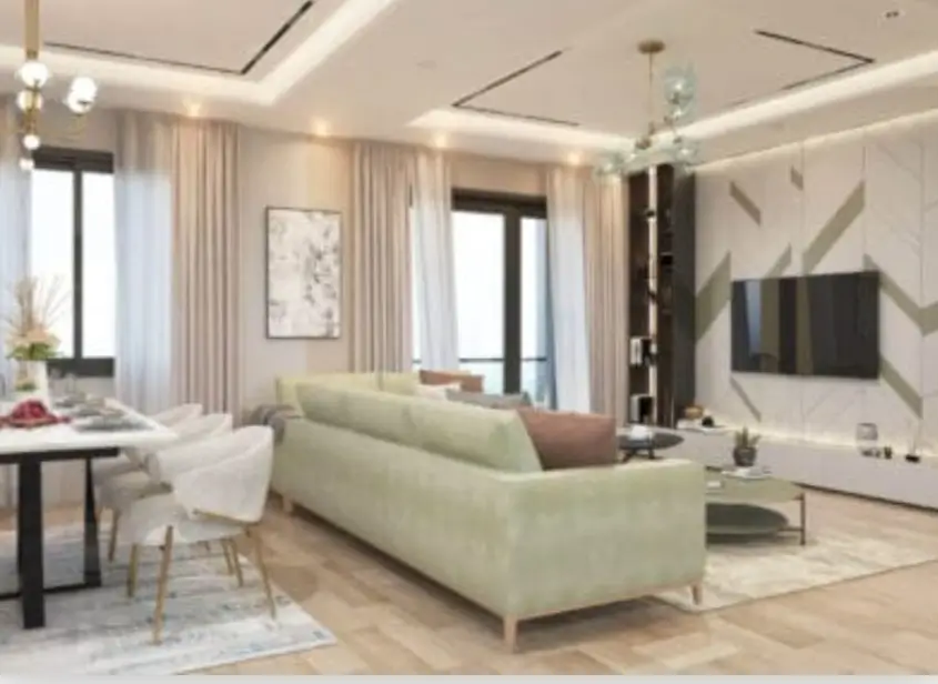 Elegant open-plan living room with TV wall and sofa