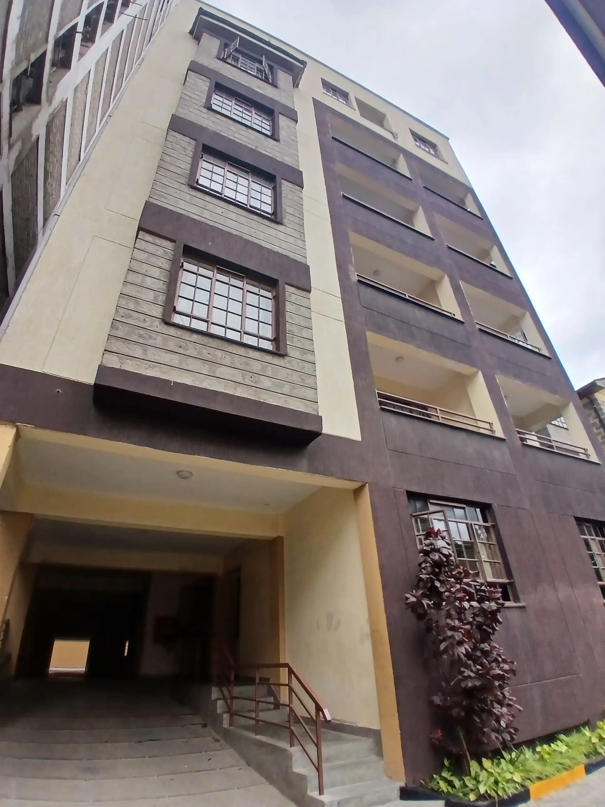 Modern apartment building facade with ground-floor entrance
