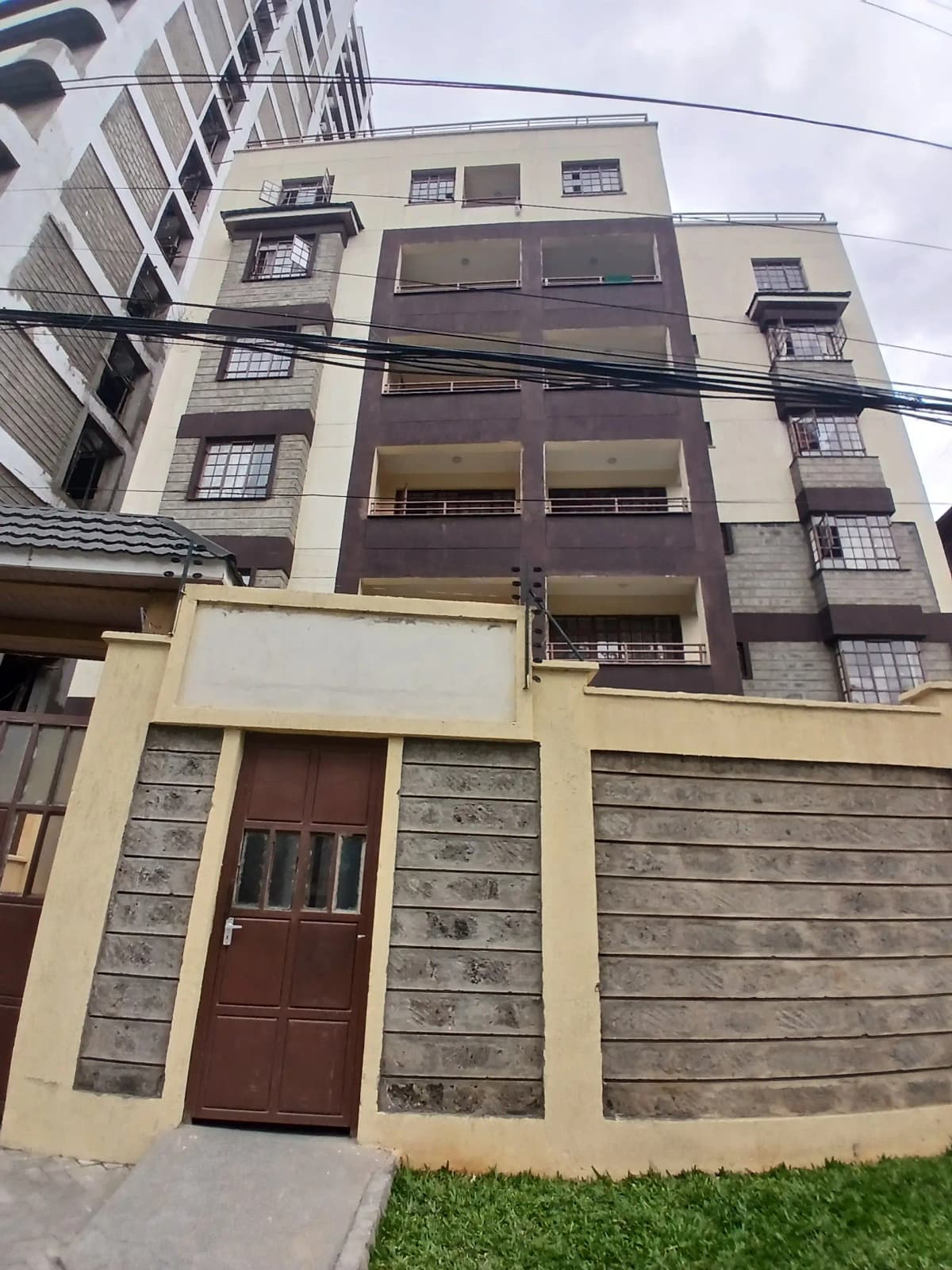 Modern multi-story residential building facade with balconies