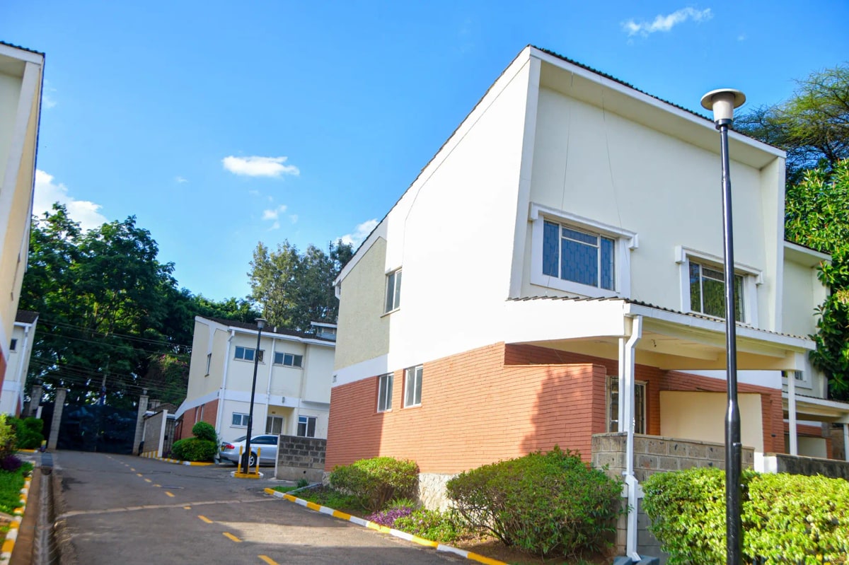 Modern two-story residential building with brick and white facade