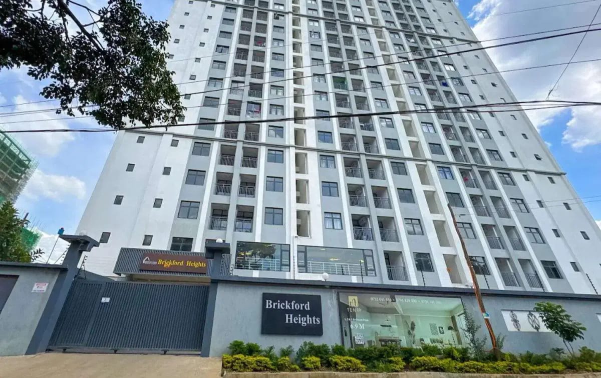 Modern multi-story residential building facade with commercial base