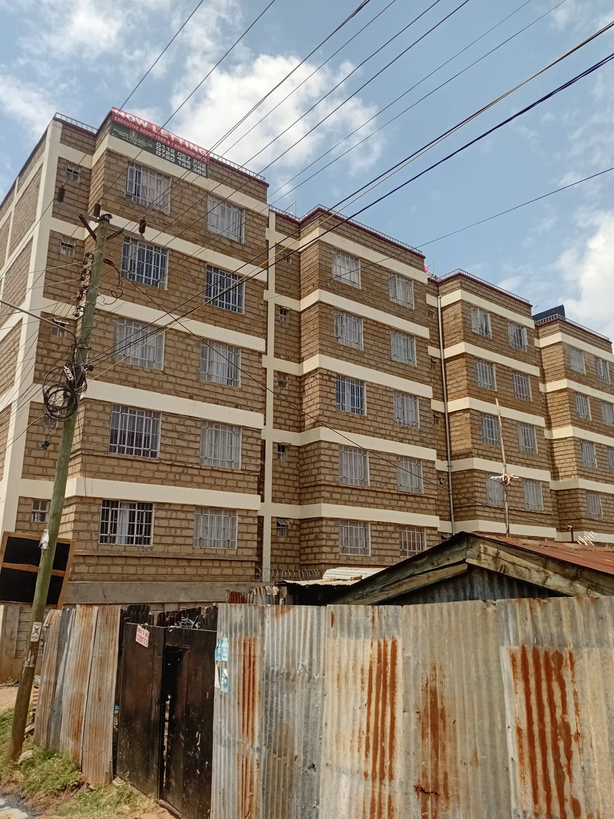 Mid-rise residential building facade with stone cladding