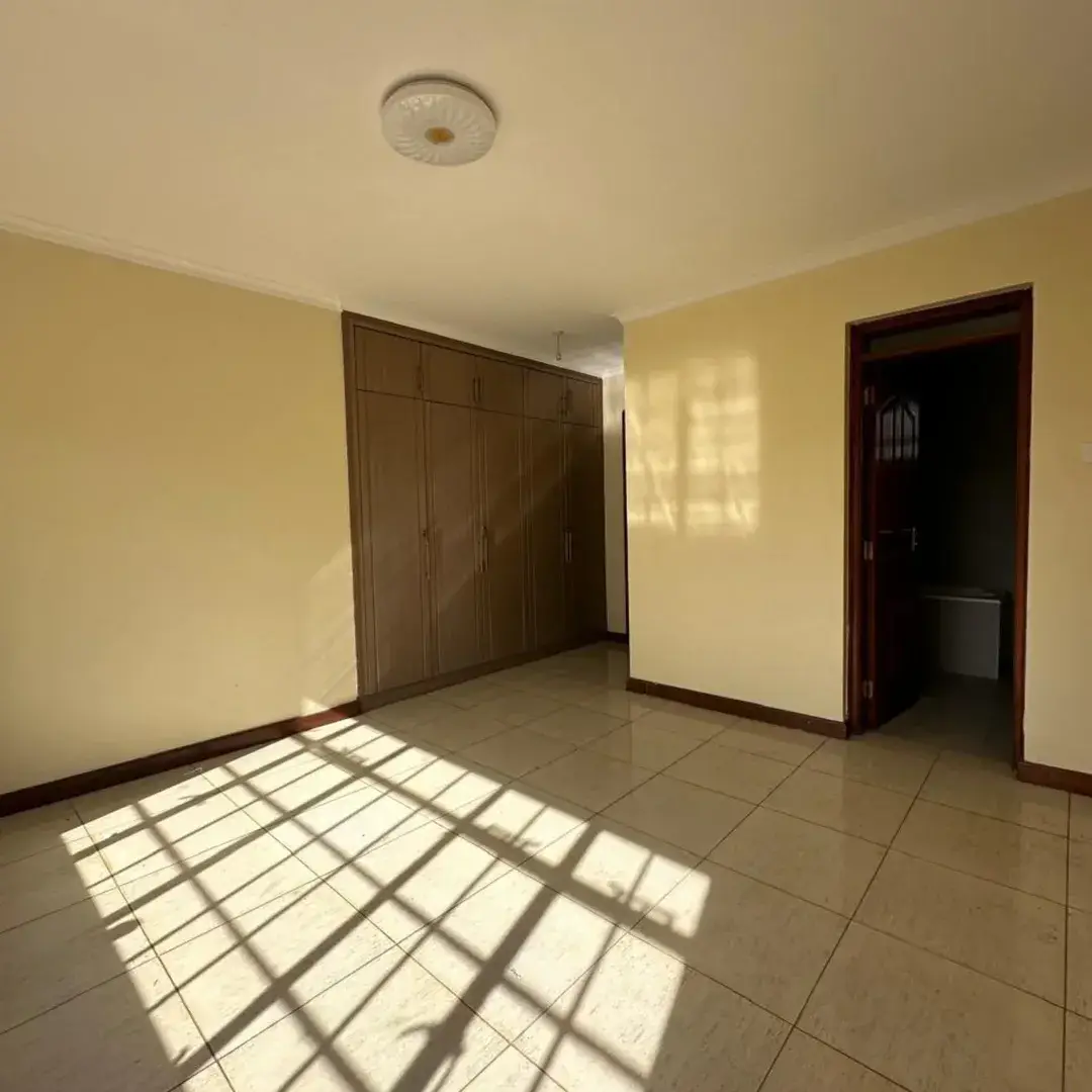 Bright living room with tiled floors and afternoon light