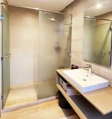 Modern bathroom with walk-in shower and vanity sink