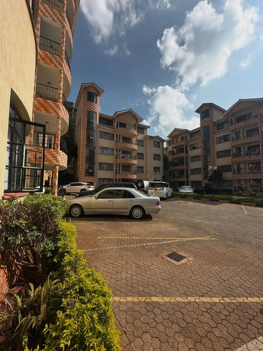 Shared compound parking area with residential blocks