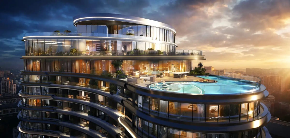 Luxury high-rise facade with rooftop infinity pool at sunset
