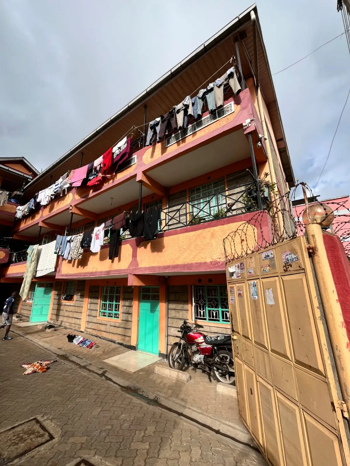 Multi-story residential building facade with colorful painted walls