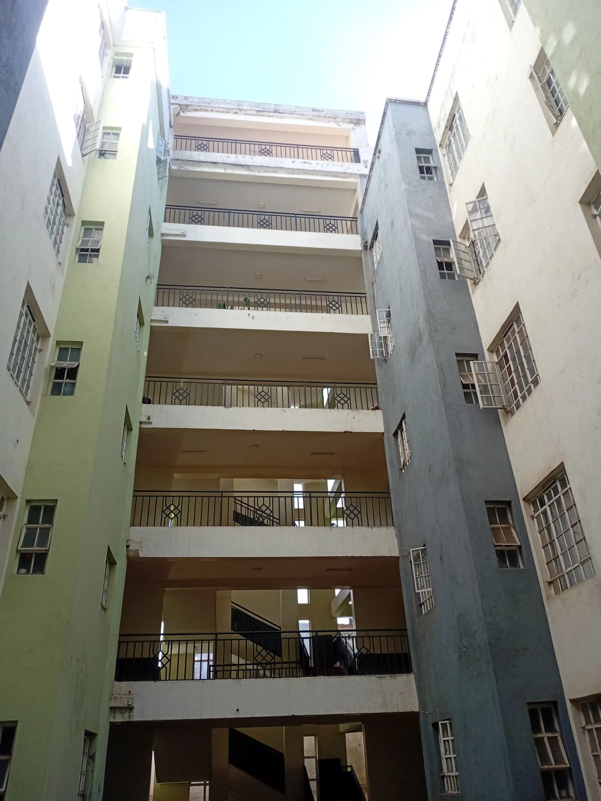 Multi-story apartment building facade with balconies