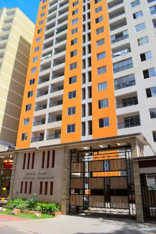 Modern apartment building with orange and white facade