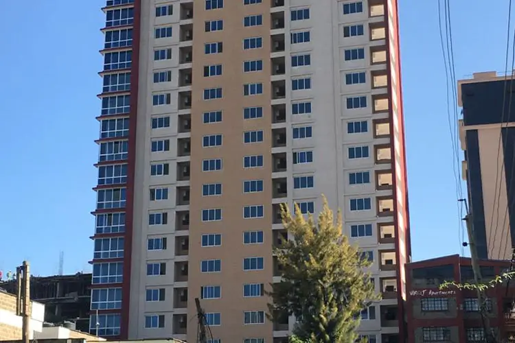 Multi-story residential building facade with regular window pattern