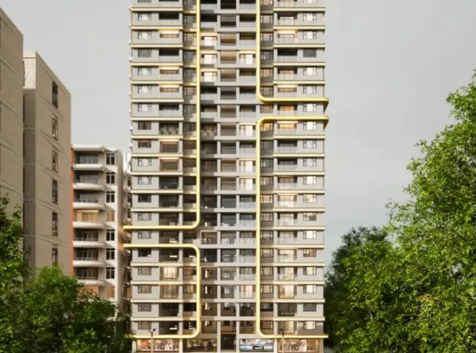 Tall modern high-rise tower with gold accent facade