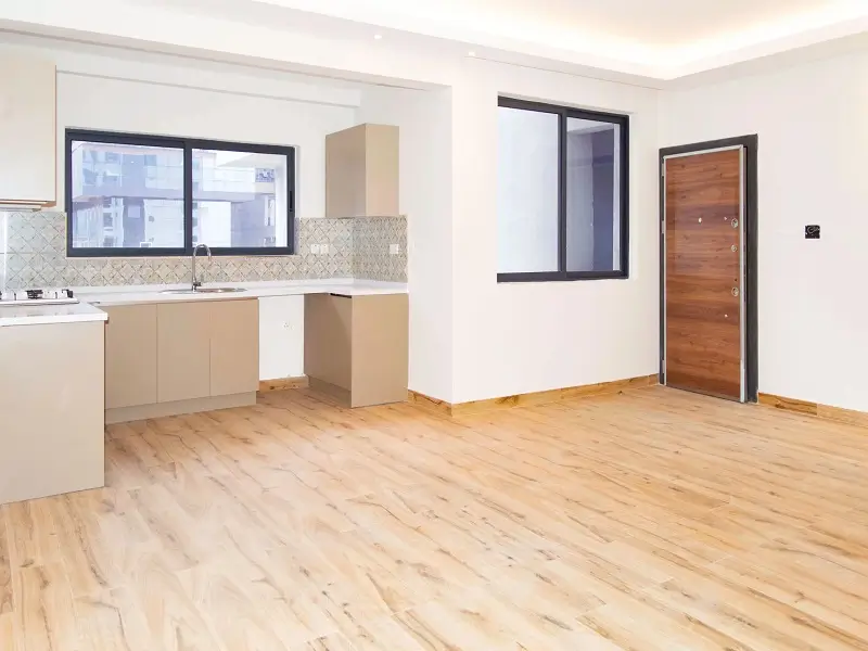 Open-plan living and kitchen with wooden flooring, modern finishes