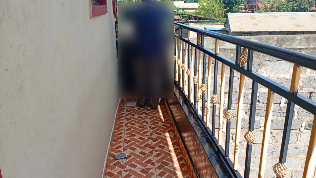 Narrow balcony with herringbone tile flooring and metal railing