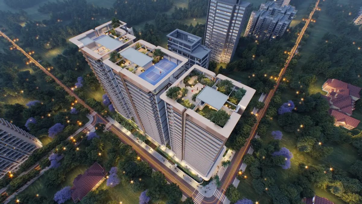Aerial CGI render of tall residential tower at dusk