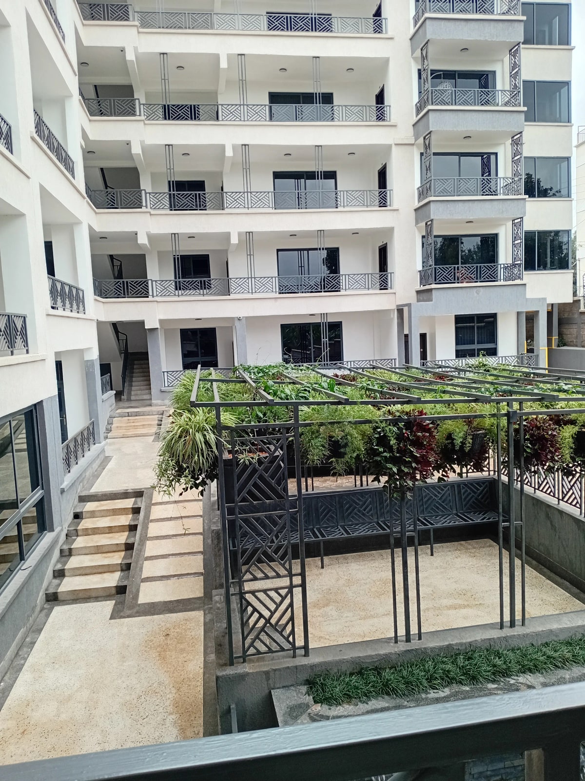 Modern apartment building courtyard with landscaped grounds
