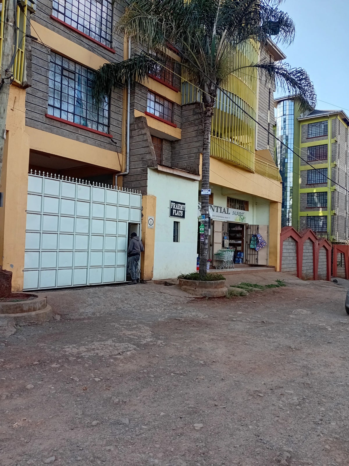 Multi-story residential building facade with garage entrance