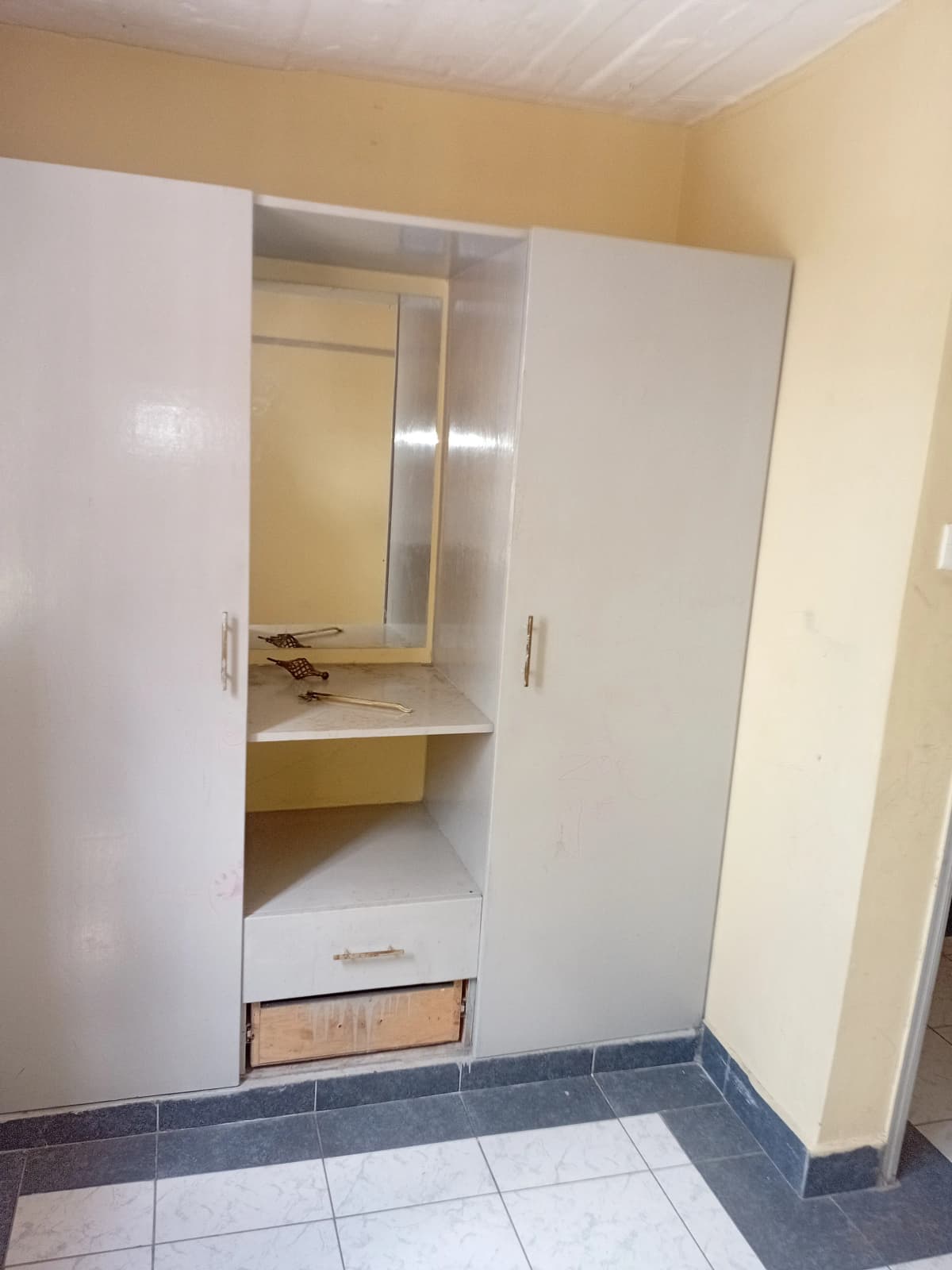Bedroom with built-in wardrobe and mirror dressing area