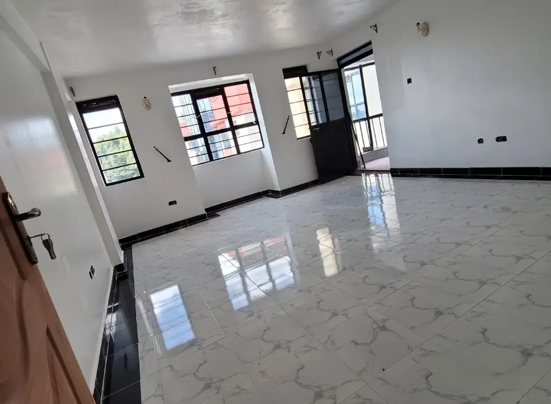 Spacious open-plan living area with polished marble flooring