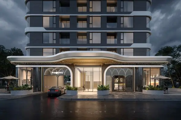 Modern high-rise building entrance with illuminated parking canopy