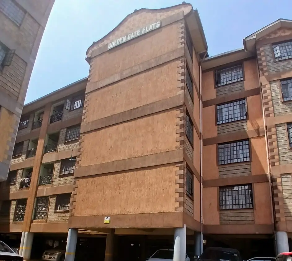 Multi-story residential building facade with ground-floor parking