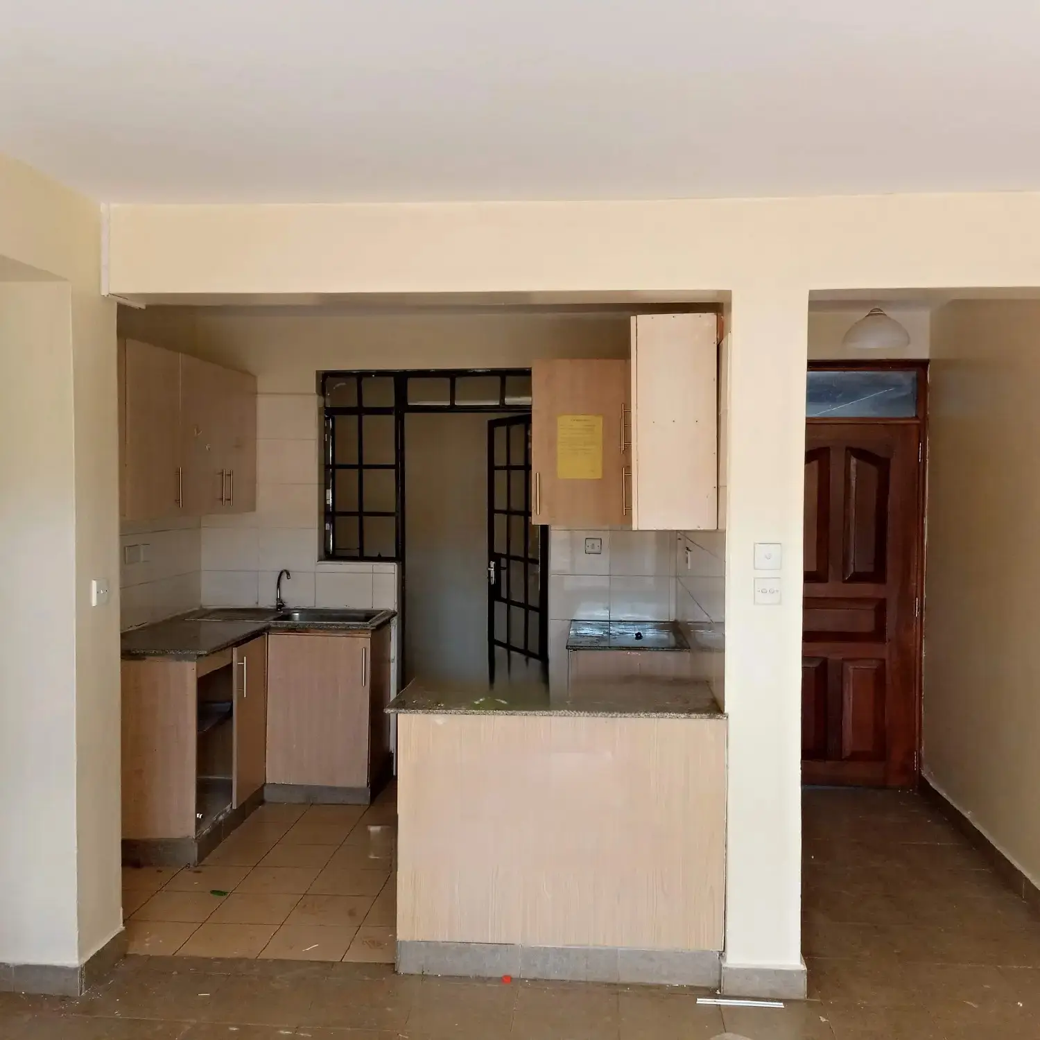 Open-plan kitchen with pass-through counter to dining area