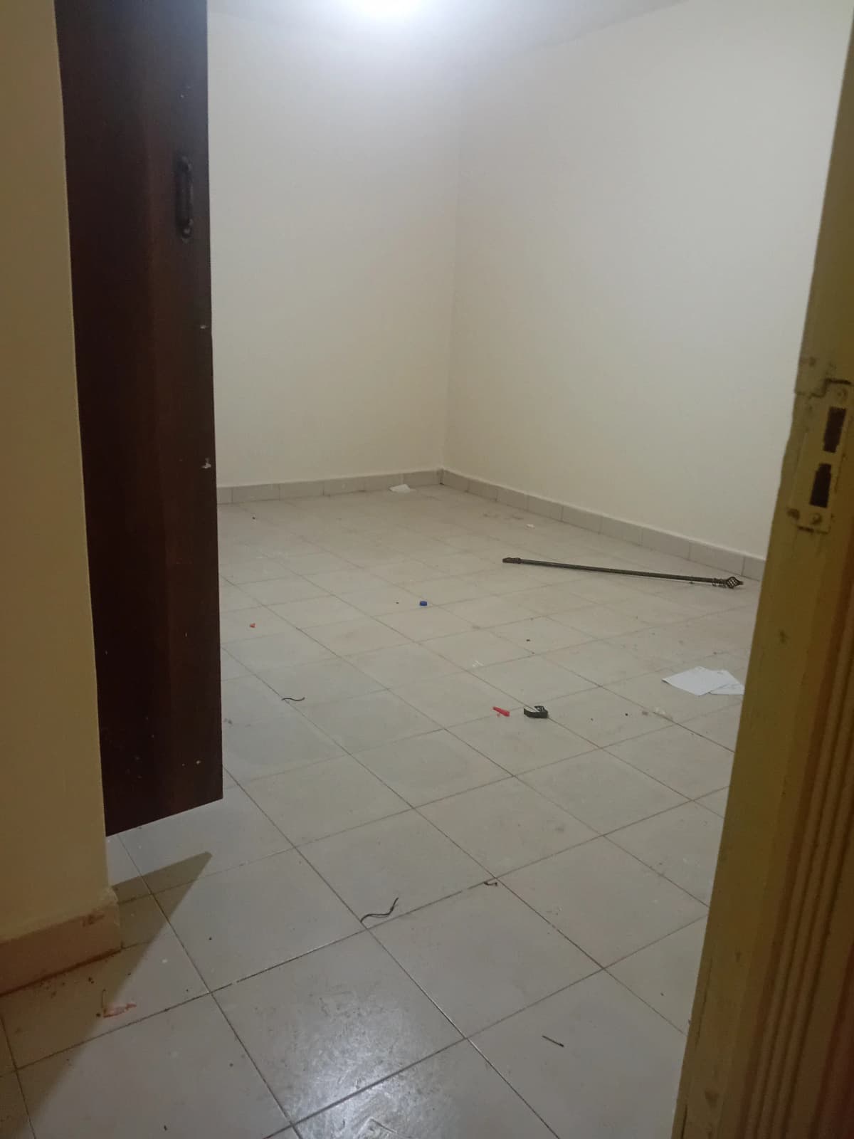 Empty bedroom with tiled floor, under construction or unfurnished