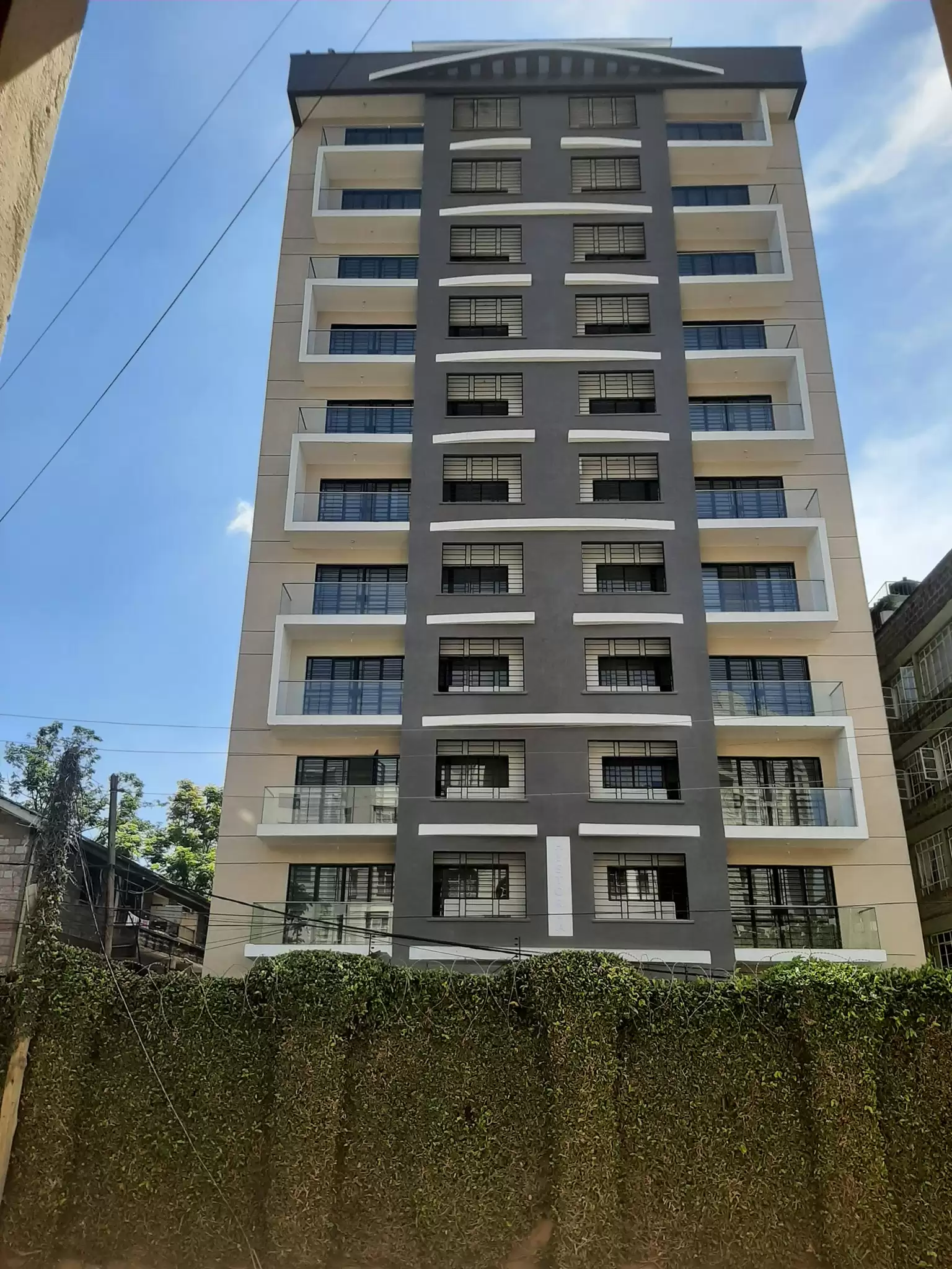 Modern multi-story residential building facade with balconies