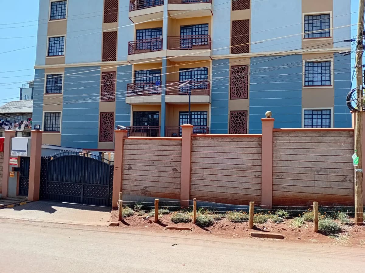 Multi-story residential building with blue and beige facade