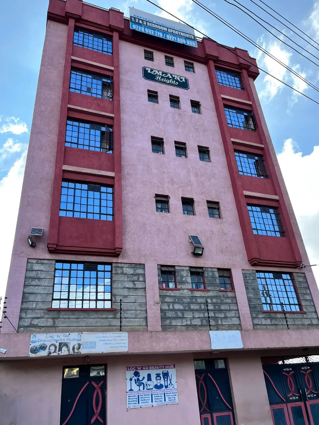 Multi-story residential building facade with commercial ground floor