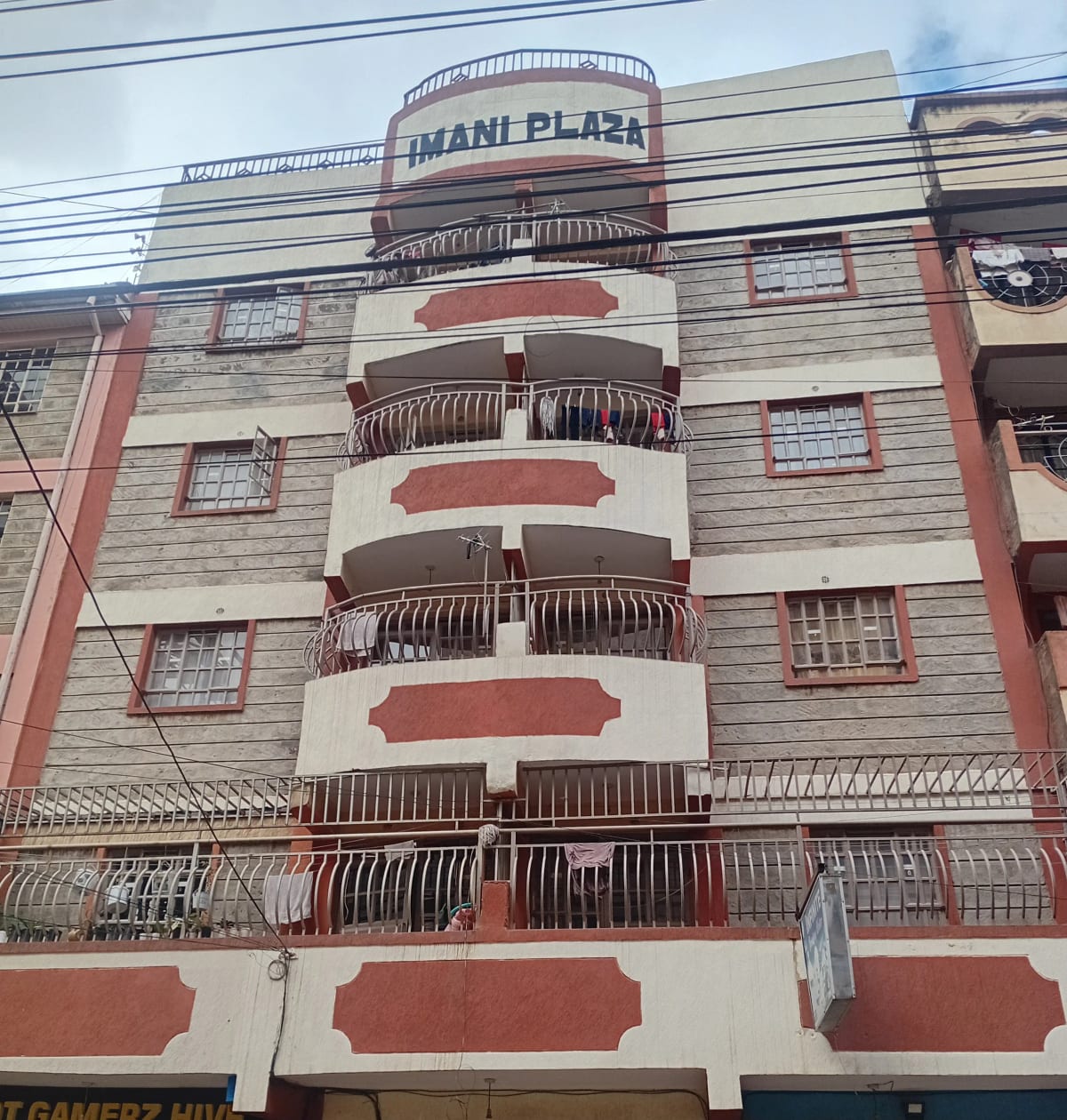 Multi-story residential building facade with curved balconies