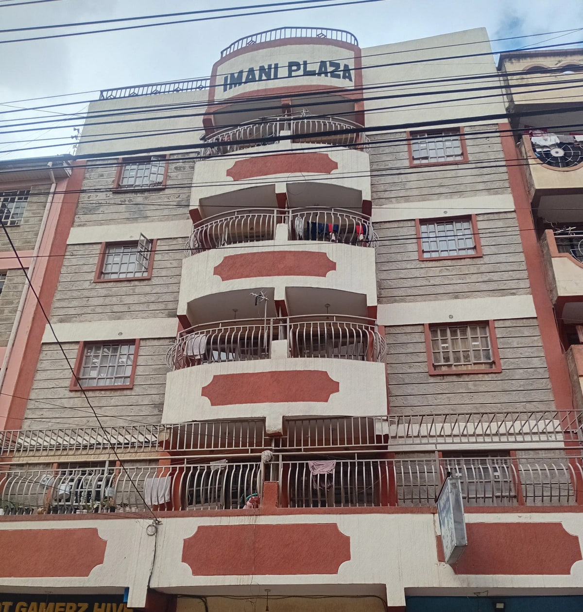 Multi-story residential building facade with curved balconies