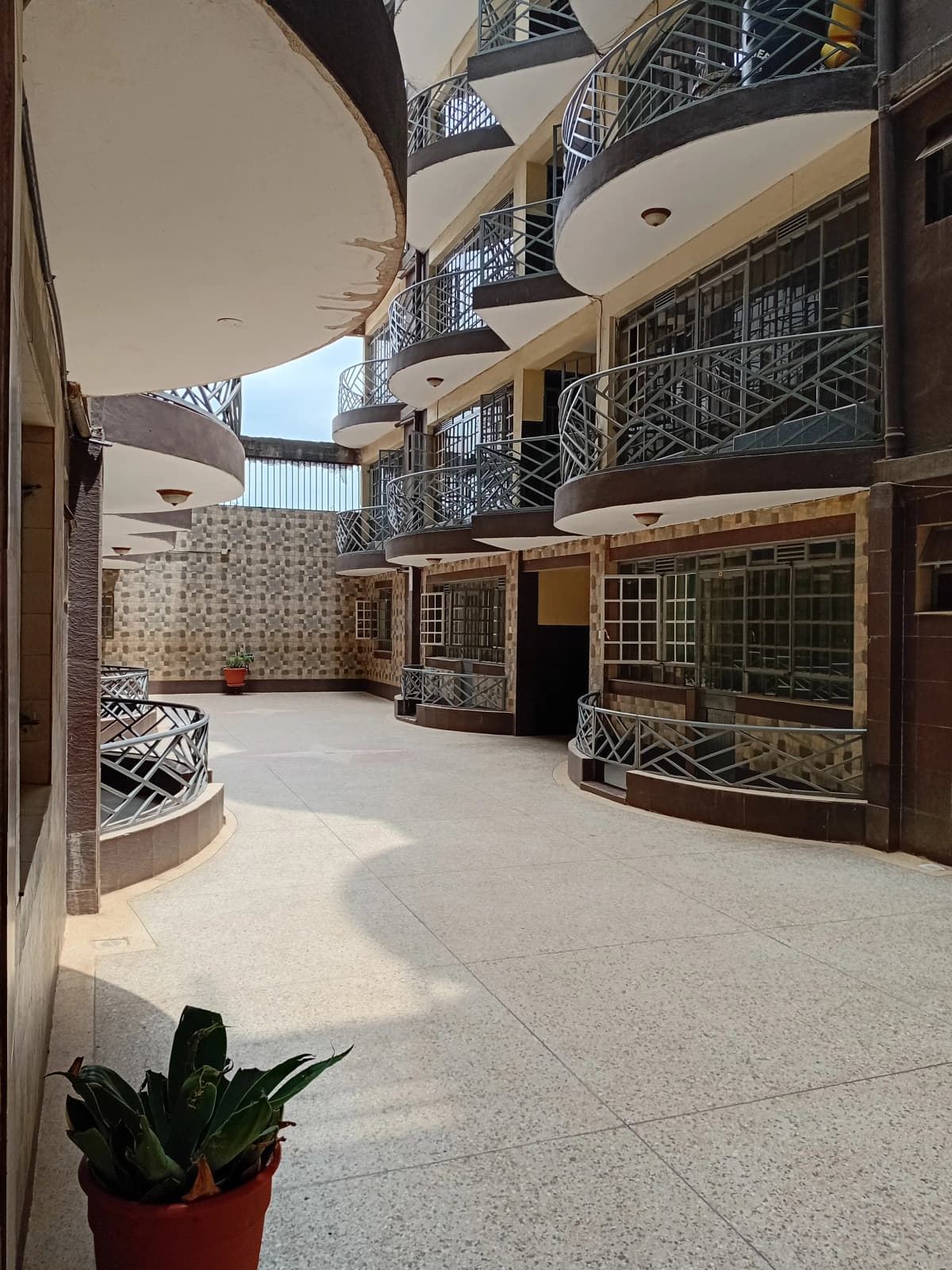 Multi-story residential compound courtyard with balconies