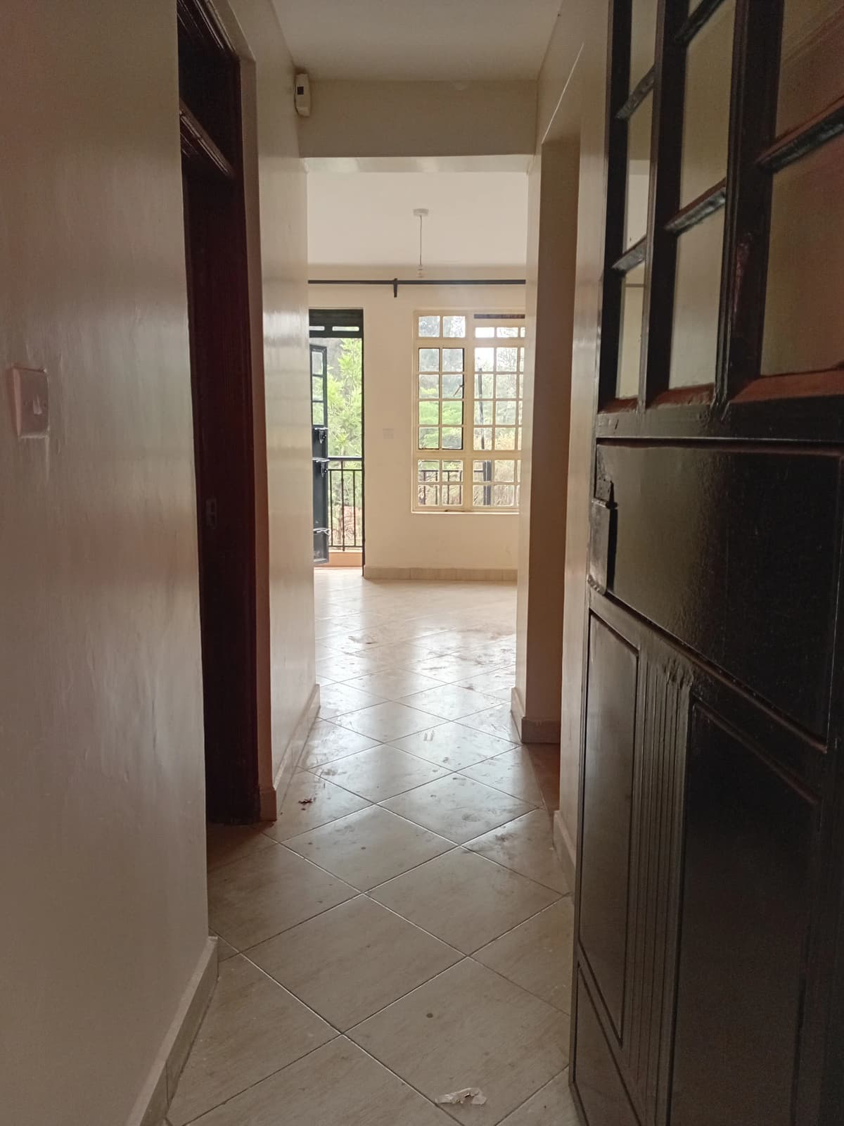 Modern kitchen with hallway passage and natural light entry