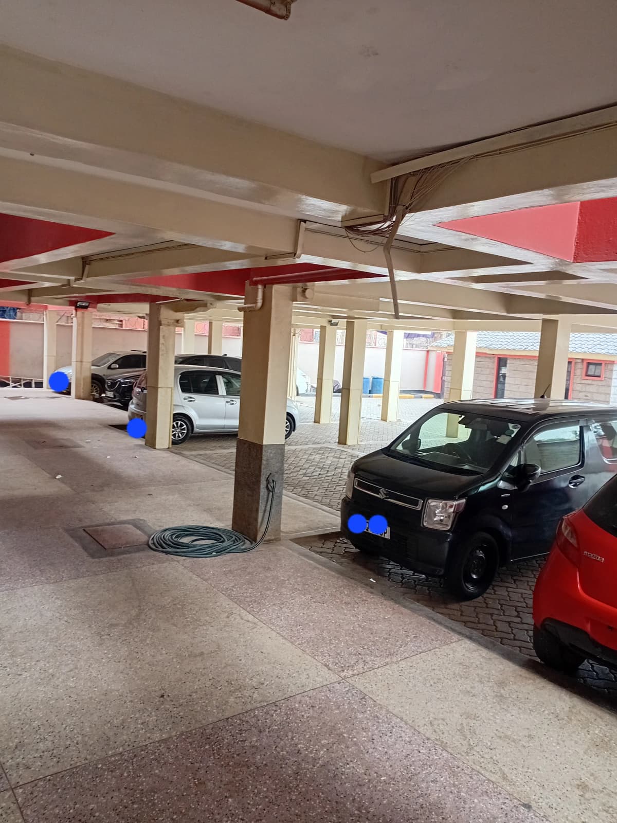 Covered basement parking with multiple vehicle bays