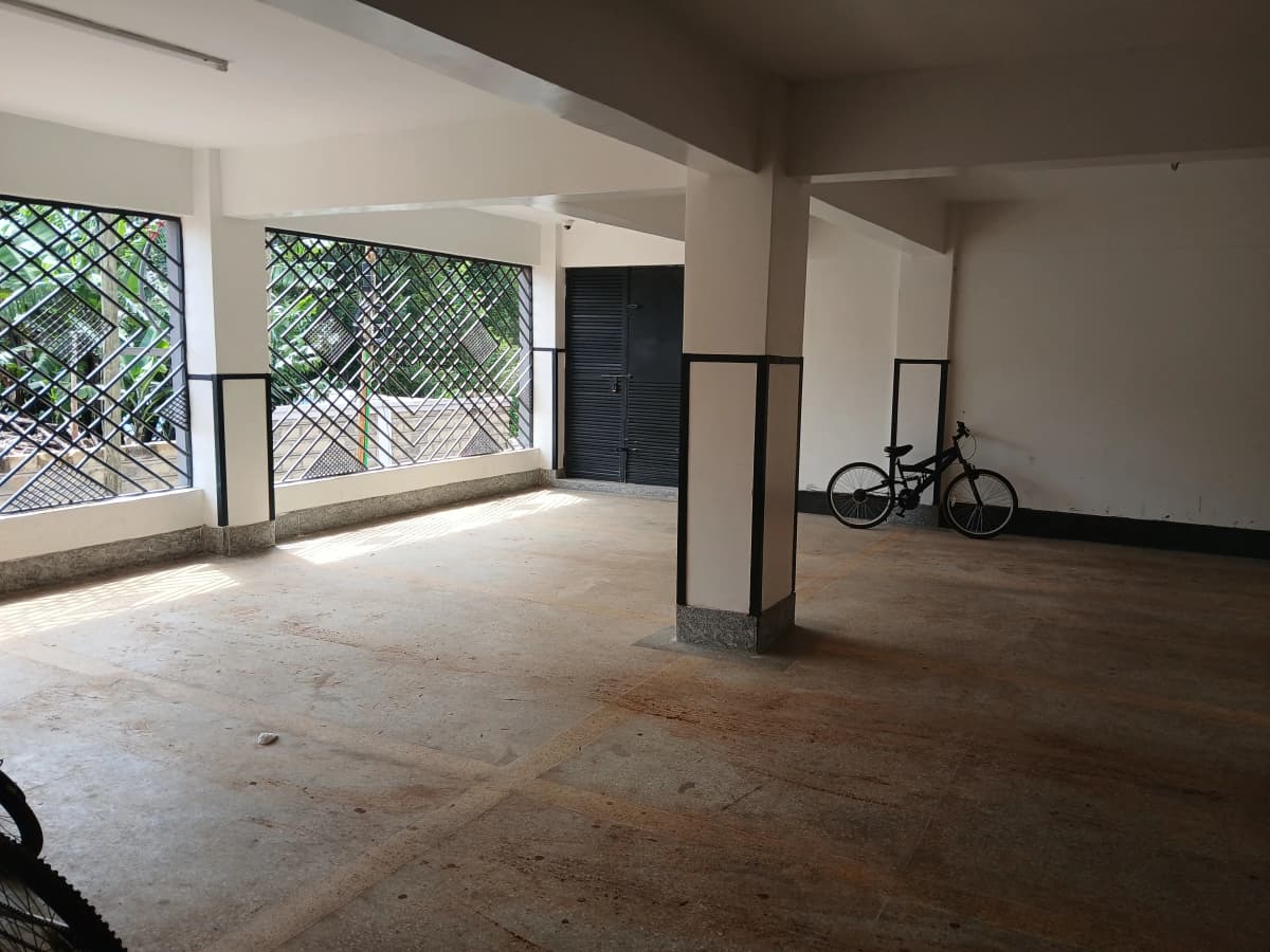 Ground floor parking area with bike storage and gated access
