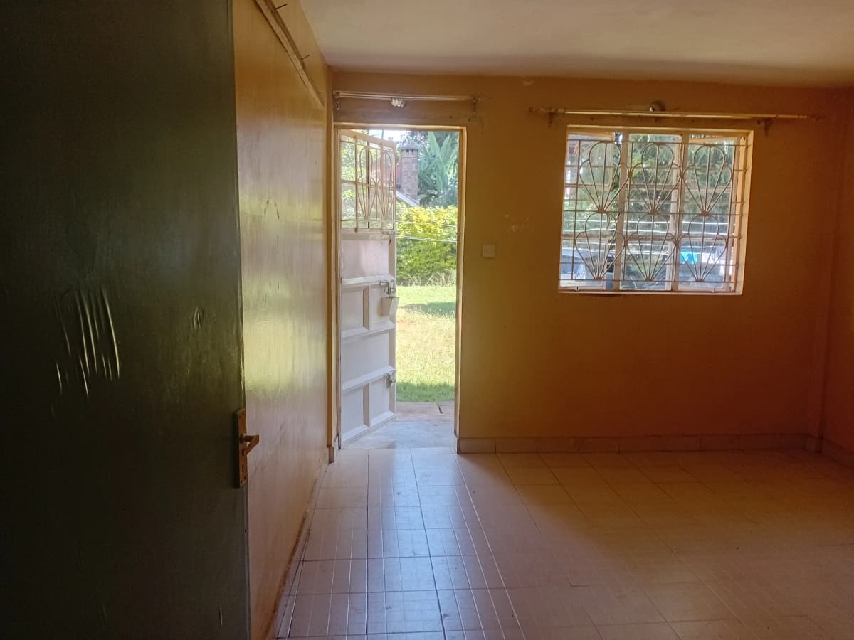 Bright corridor with glass doors opening to garden