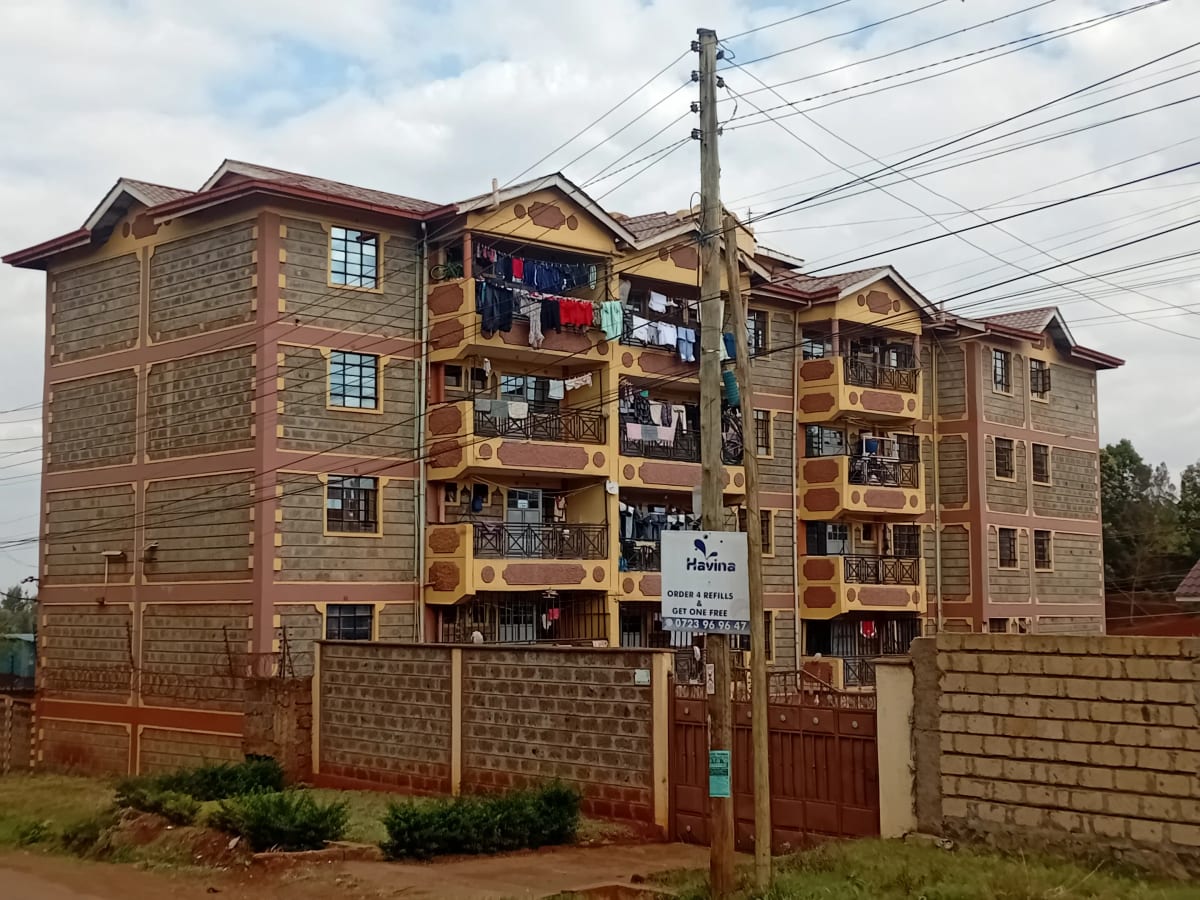 Multi-story residential building with brick facade and balconies
