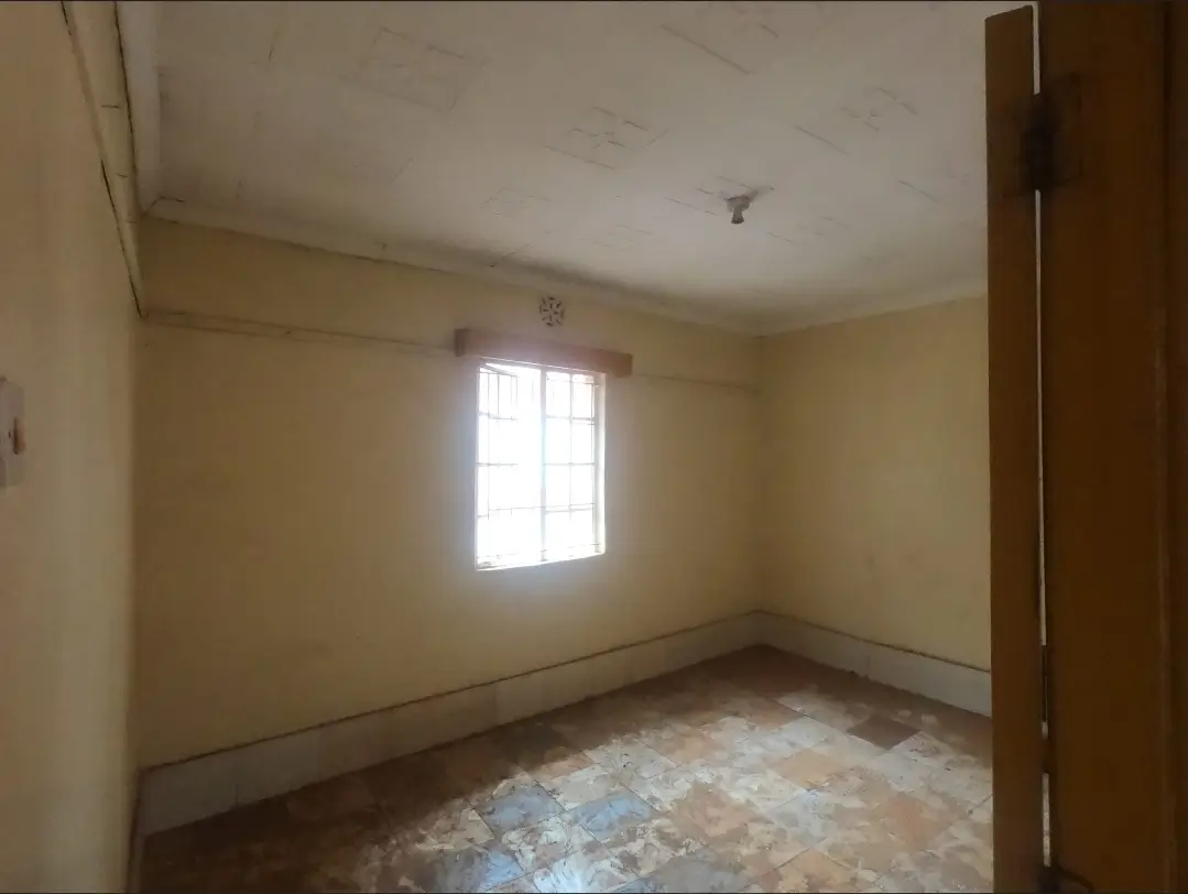 Empty bedroom with natural light from window