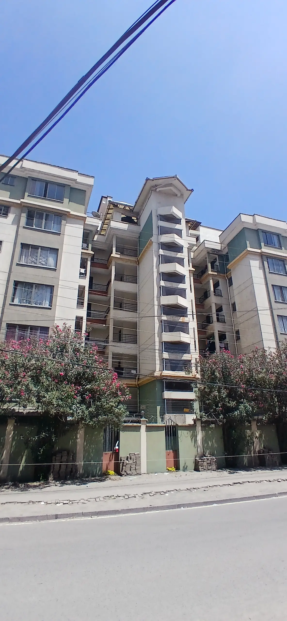 Multi-story residential building facade with street frontage