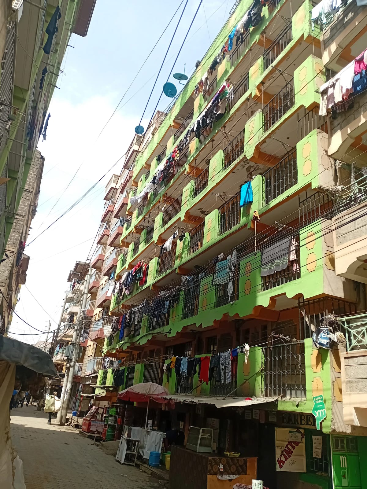 Multi-story residential building facade with colorful painted walls