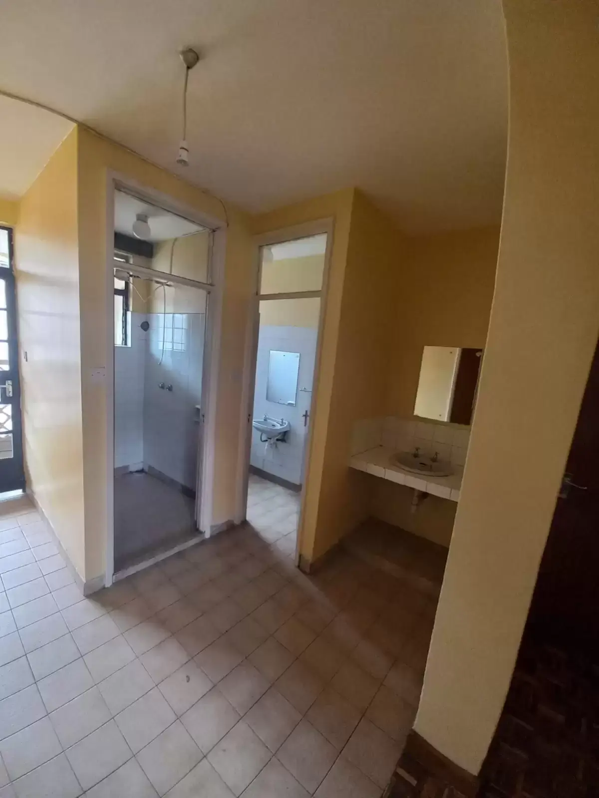 Building corridor with doorways to bathroom and bedroom