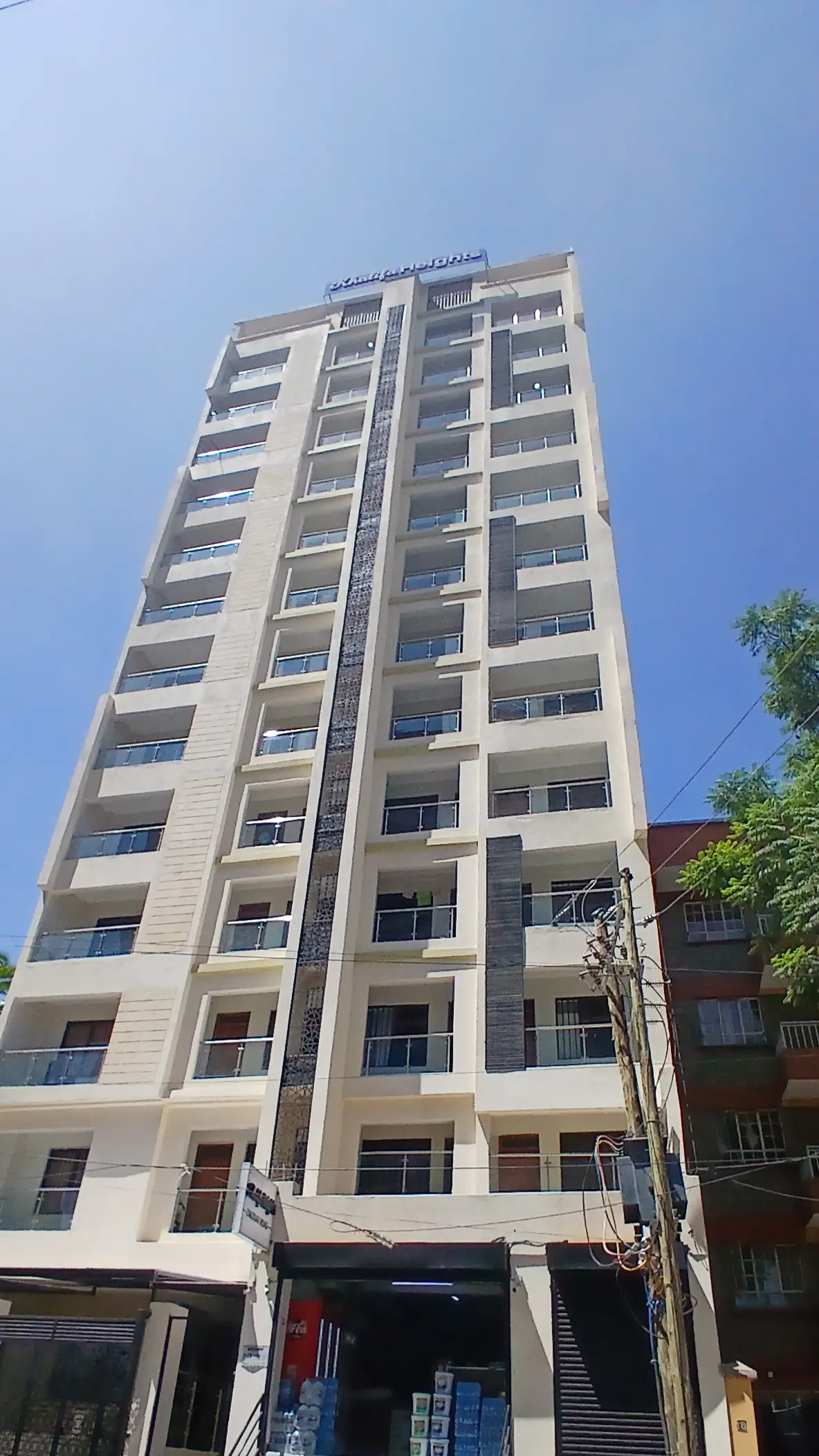 Multi-story residential building facade with uniform balconies