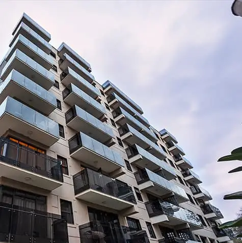 Modern multi-story residential building facade with balconies