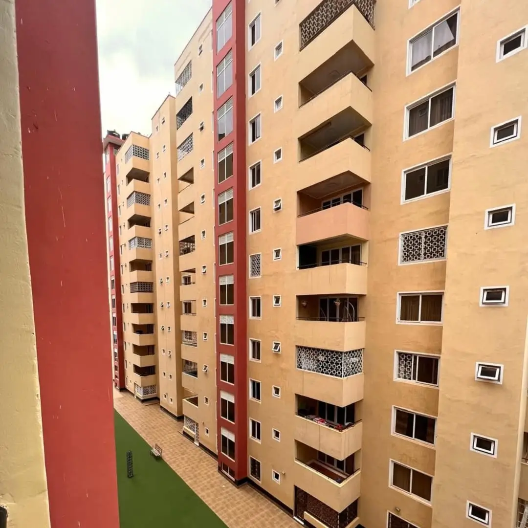 Multi-story residential apartment building facade with balconies