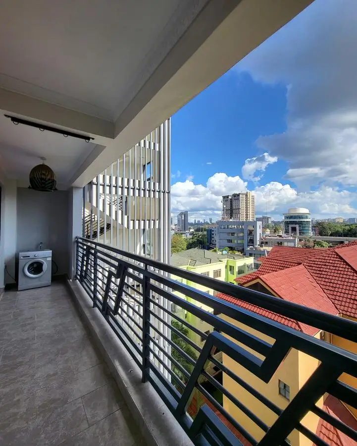 High-rise balcony with city skyline and landscape views