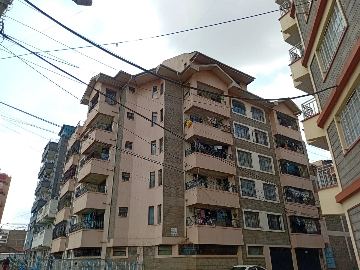 Multi-story residential apartment building facade with balconies