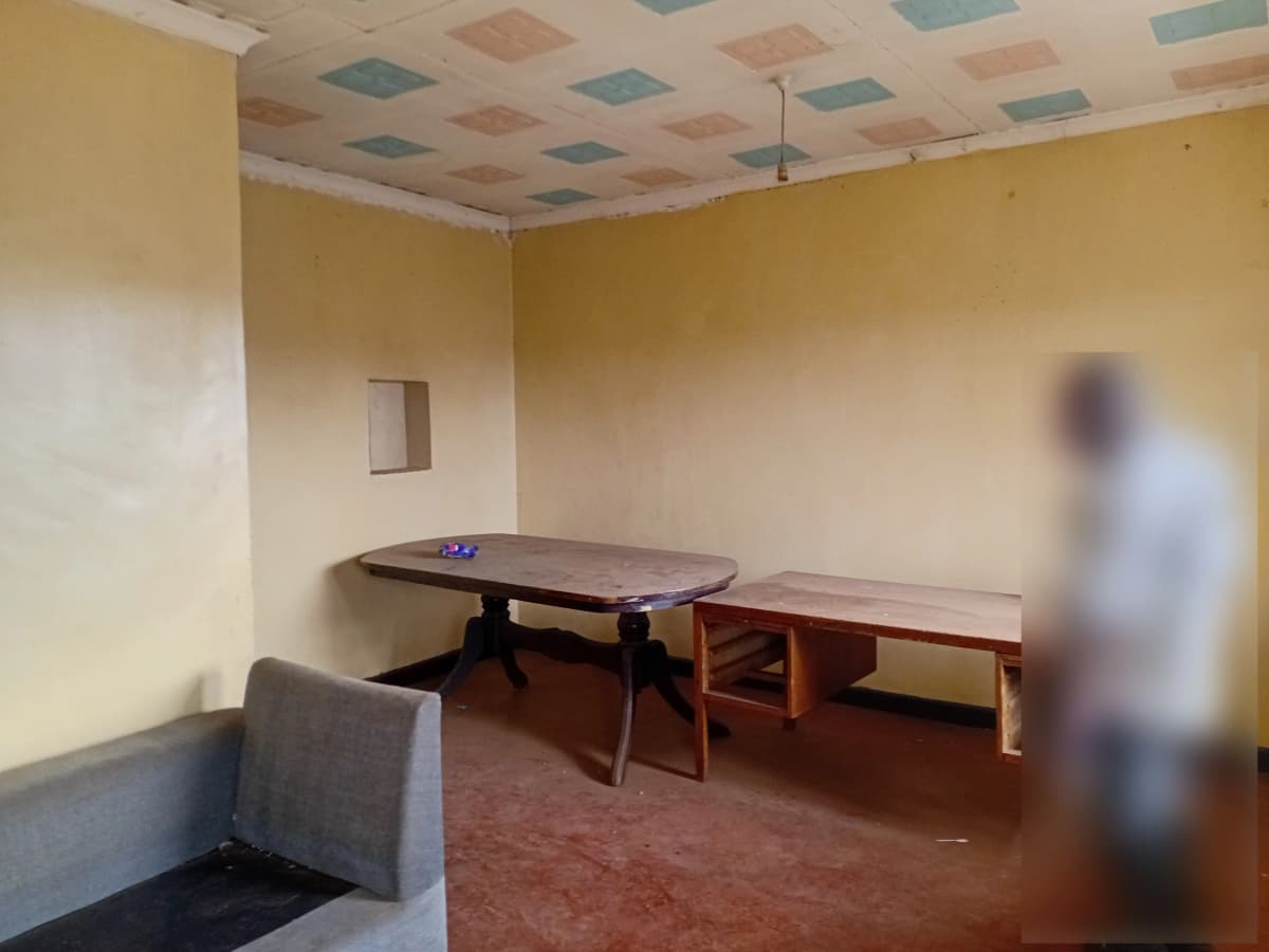 Empty room with ping pong table and work surfaces