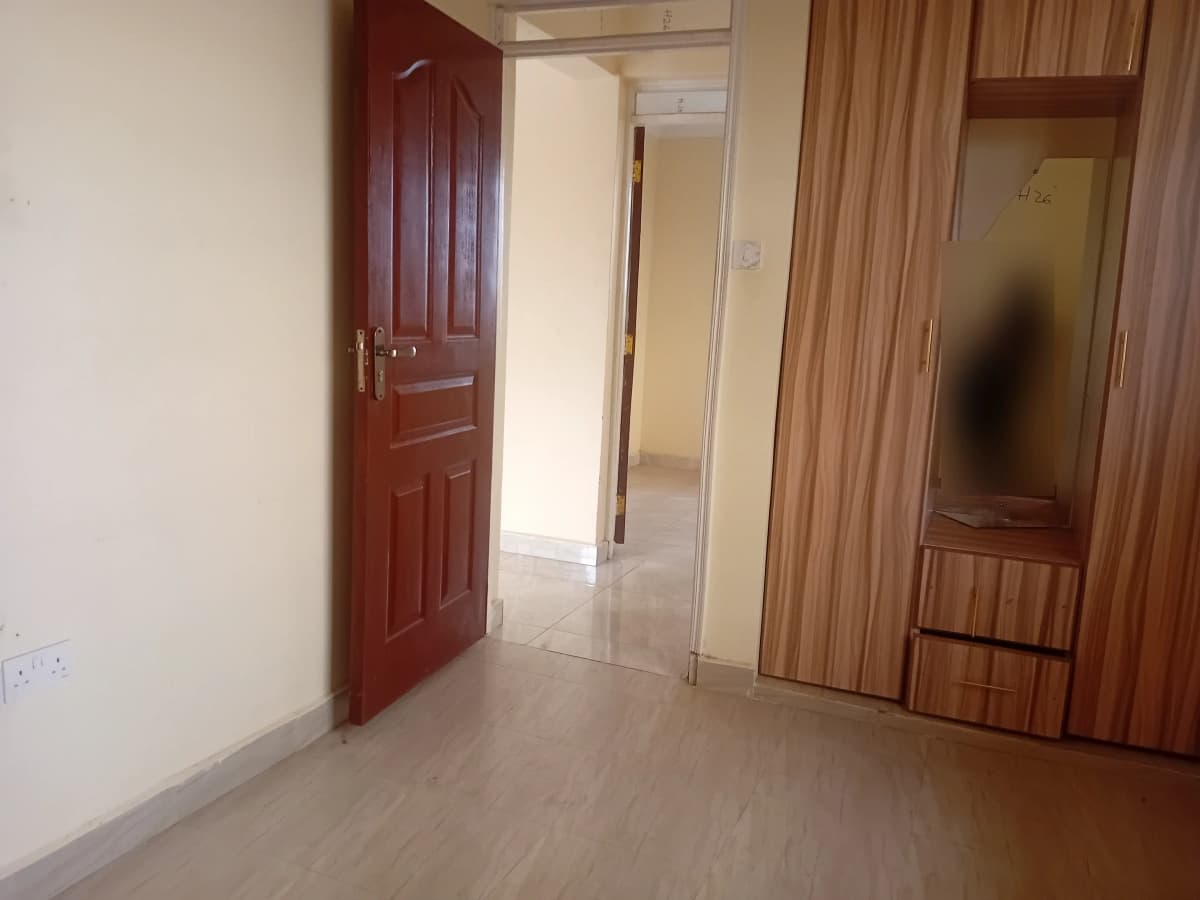 Building corridor with wooden doors and neutral flooring