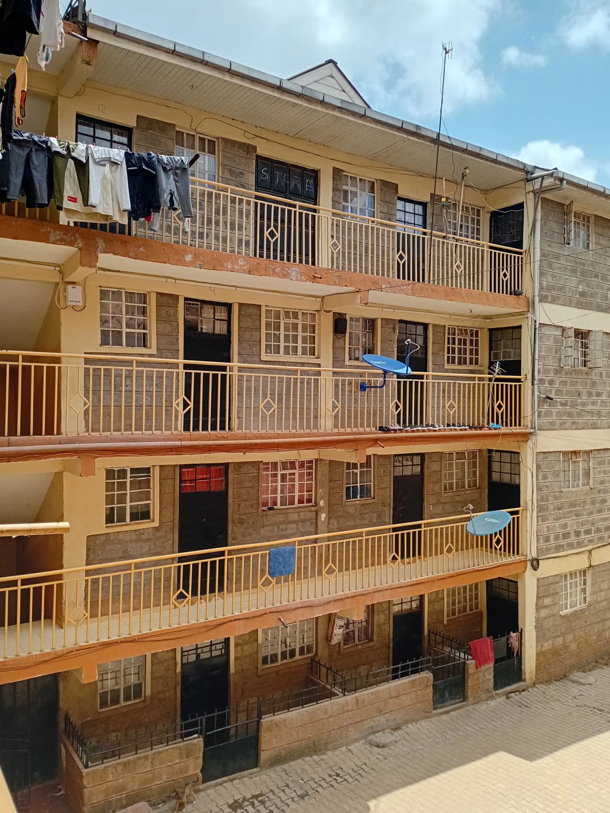 Multi-story residential building facade with balconies and windows