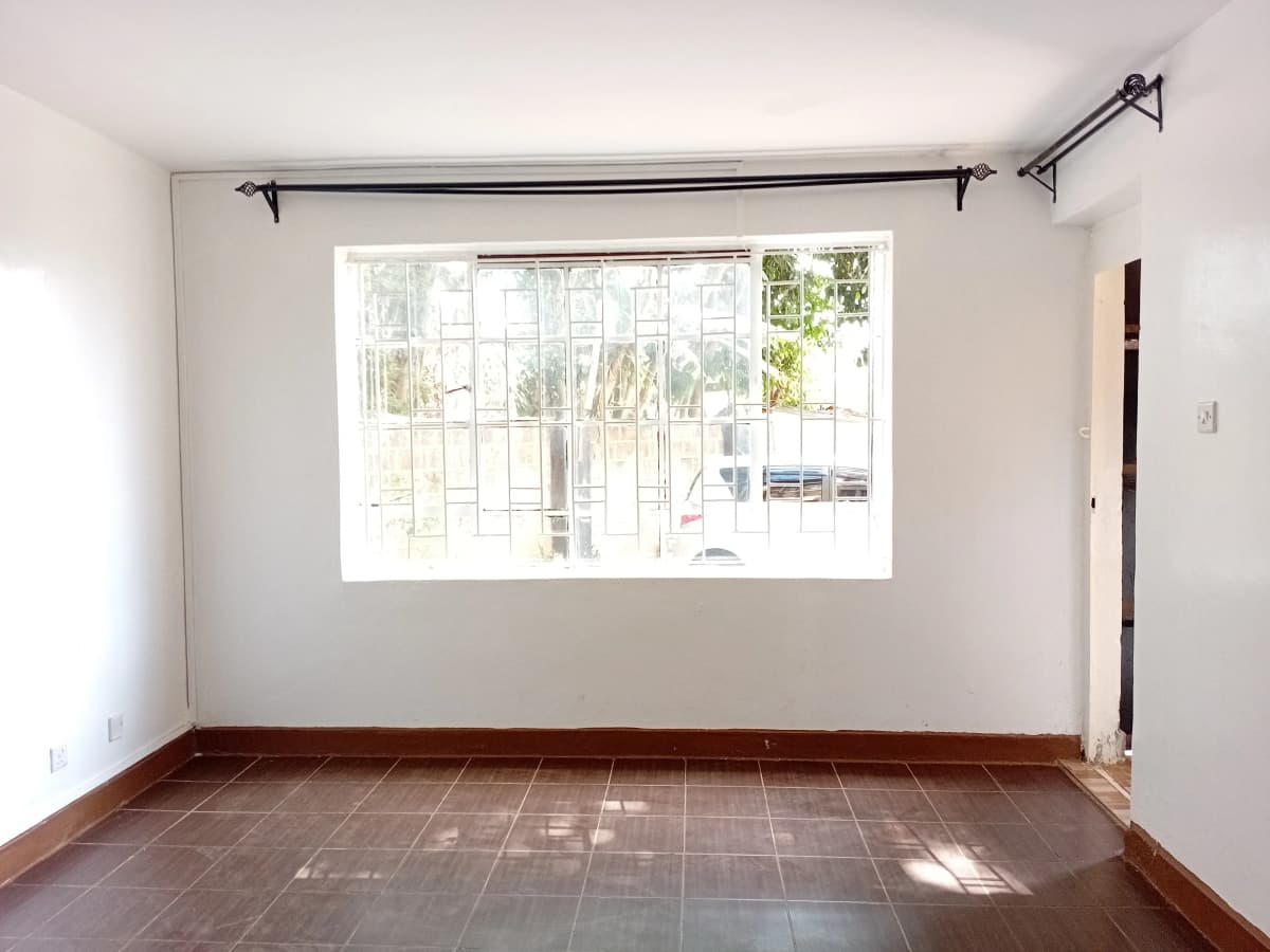 Bright living room with terracotta tiles and large windows
